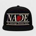 NADE all-black snapback with cream embroidered logo and red grenade emblem