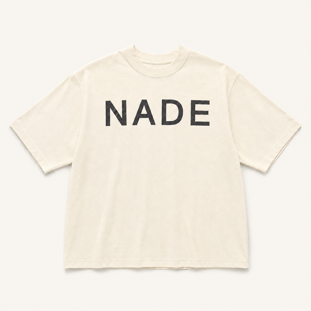 NADE Essential Logo Tee — Cream product view on warm off-white background