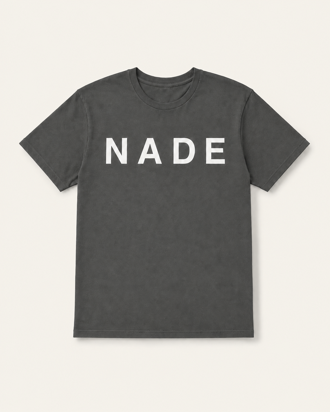 NADE Logo Tee product view on warm off-white background