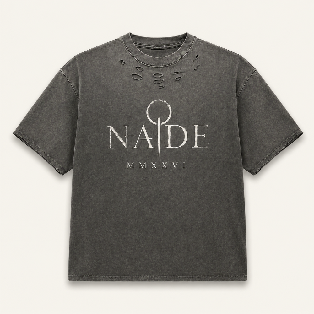 NADE MMXXVI Distressed Tee — Washed Charcoal product view on warm off-white background