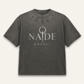 NADE MMXXVI Distressed Tee — Washed Charcoal product view on warm off-white background