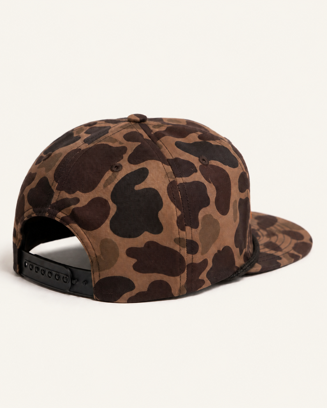 NADE x NADE Camo Snapback product view on warm off-white background