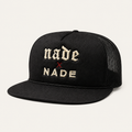 NADE x NADE Trucker Hat — Black product view on warm off-white background