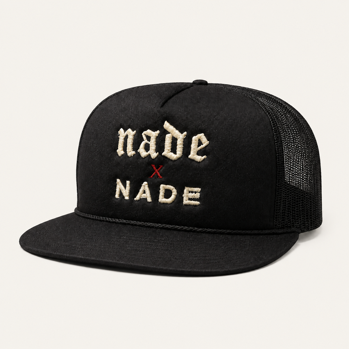 NADE x NADE Trucker Hat — Black product view on warm off-white background